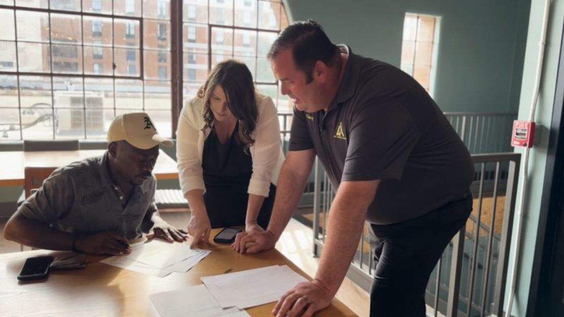 Corey Worden, president of Job Talent Connect, and Rachel Worden, regional director of operations, help a Haitian apply for a job.