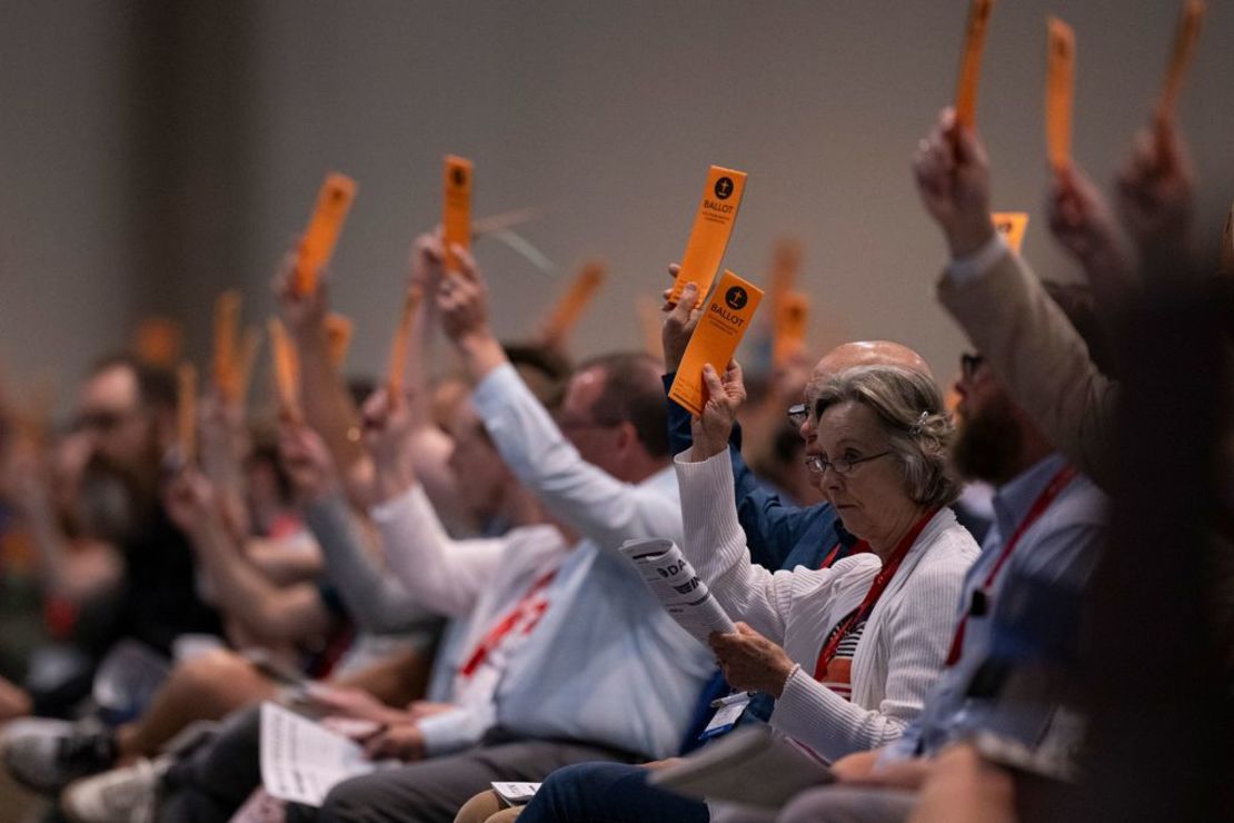 Messengers raise their ballots during a vote at the annual meeting of the Southern Baptist Convention on June 11, 2024, in Indianapolis. The CBS has traditionally opposed same-sex marriage. Credit: Doug McSchooler/AP