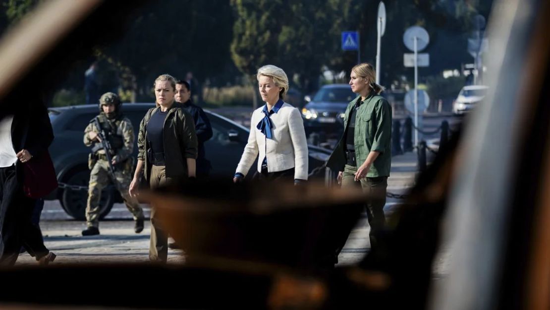 European Commission President Ursula von der Leyen, centre, on her way to visit a memorial wall commemorating Ukrainian soldiers who fell in the war with Russia, in kyiv on September 20. Christoph Soeder/AP