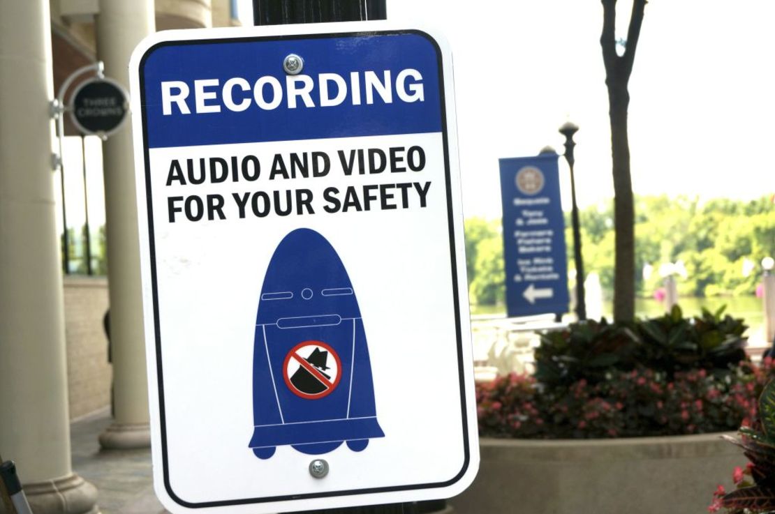 A sign informs the public about a five-foot-tall outdoor K5 security robot that patrols the grounds of the Washington Harbor shopping center in the Georgetown district of Washington on July 26, 2017.