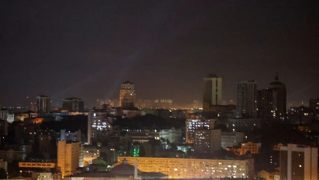 Ukrainian military personnel use searchlights to search for drones in the sky above the city center during a Russian drone strike in Kyiv, Ukraine, September 7, 2024.