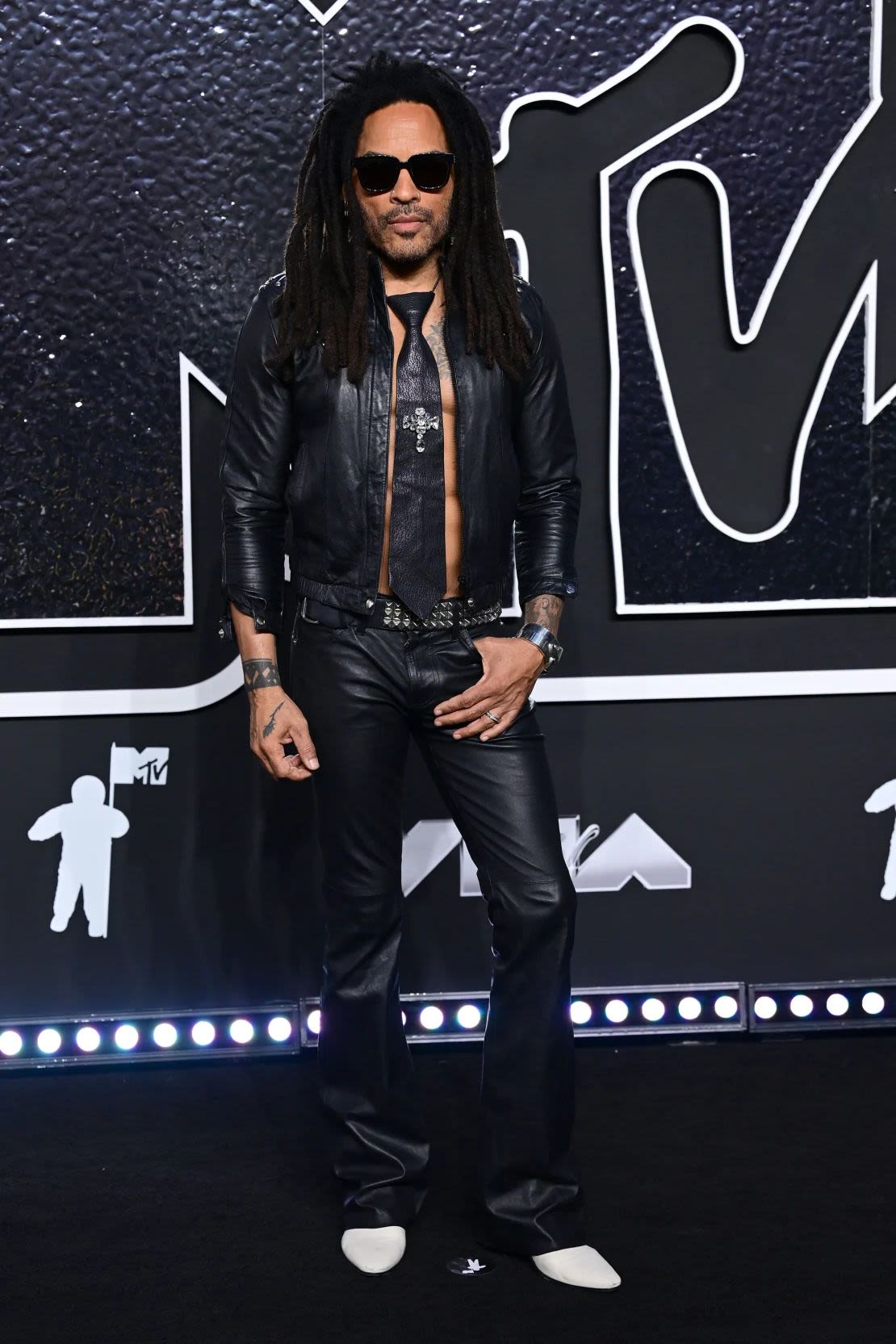 Lenny Kravitz, who received the VMA Award for Best Rock Song, arrived in an all-black leather and shirtless outfit, complete with a matching tie. Credit: Anthony Harvey/Shutterstock.